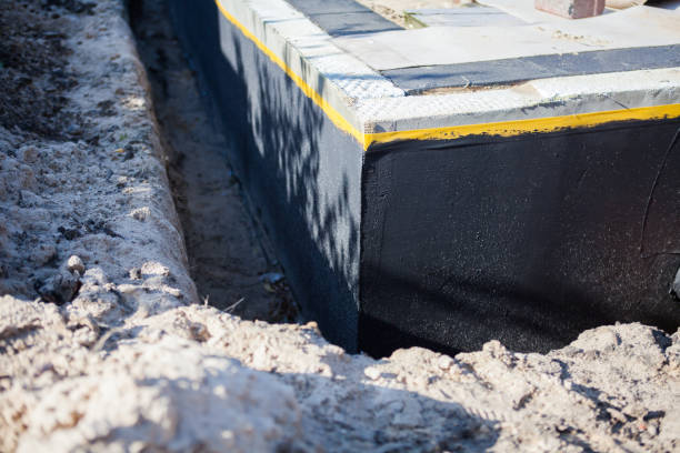 Professional Basement Waterproofing technician working in Acworth, GA